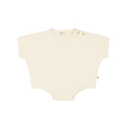 Oversized romper Crema
